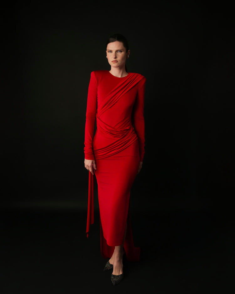 Abito lungo con schiena scoperta e drappeggi