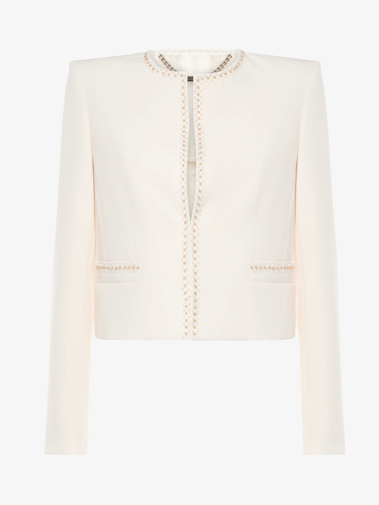 Short jacket in technical edge fabric with jewel applications