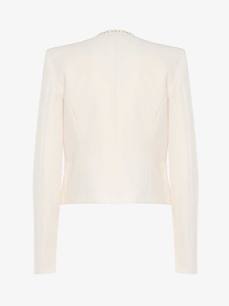 Short jacket in technical edge fabric with jewel applications