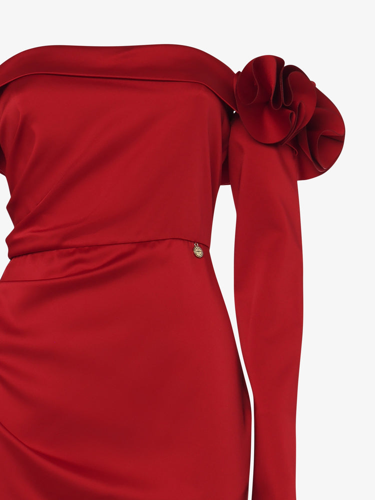 Long dress with draped boat neckline in satin with flower decorations