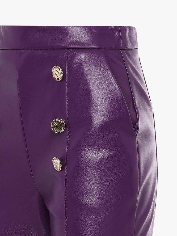 Straight leg trousers in eco leather and metal buttons