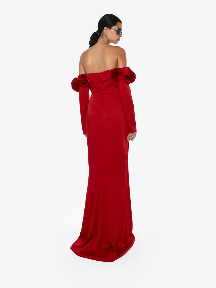 Long dress with draped boat neckline in satin with flower decorations