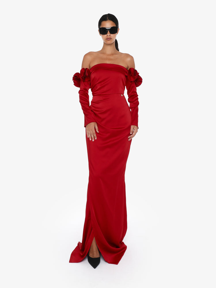 Long dress with draped boat neckline in satin with flower decorations