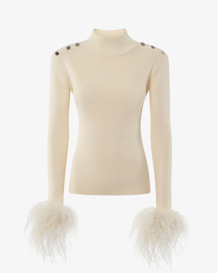 Maglia a collo alto con bottoni metallici e polsi piume