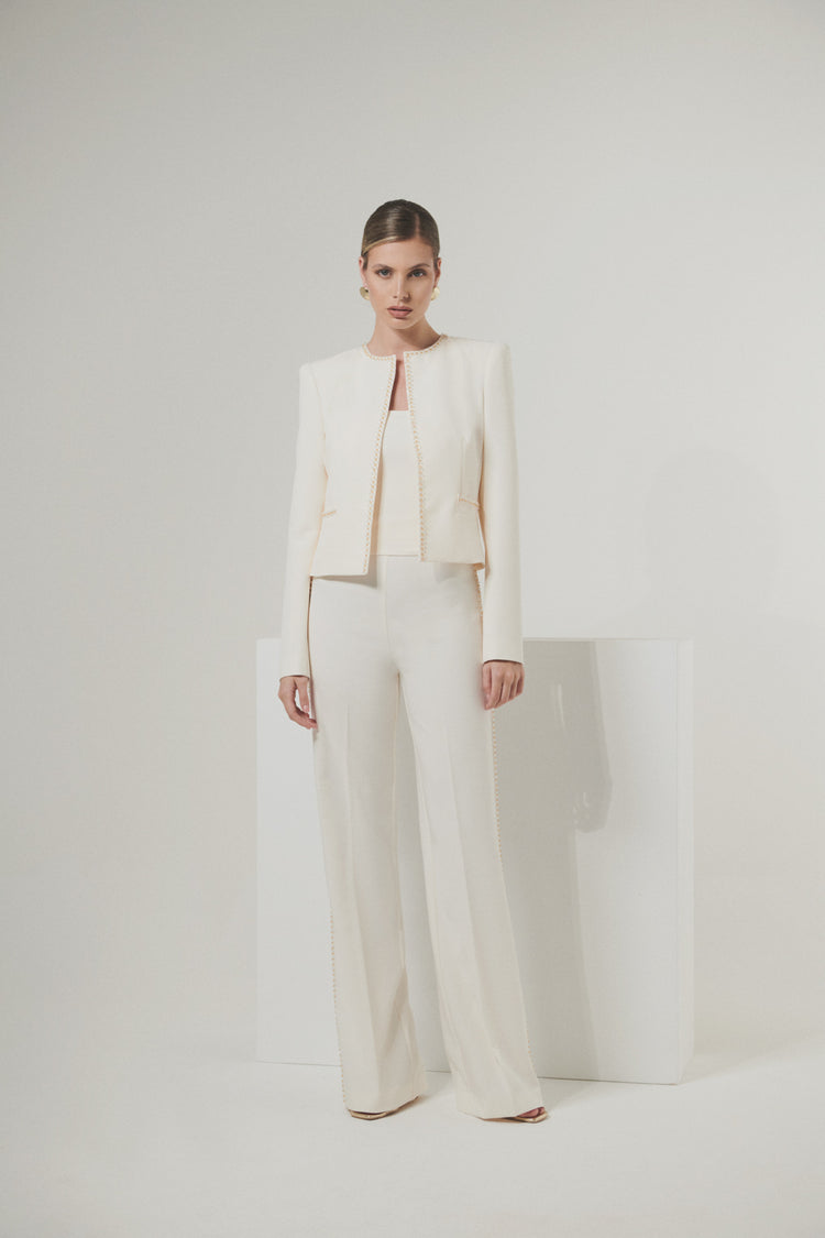 Short jacket in technical edge fabric with jewel applications