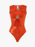 Body in jersey metallizzato con cut out e decorazioni metalliche