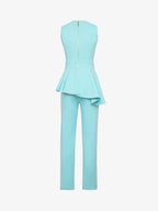 Elegant jumpsuit in technical fabric with ruffles and metallic decoration at the waist