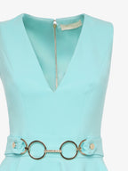 Elegant jumpsuit in technical fabric with ruffles and metallic decoration at the waist