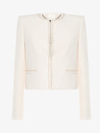 Short jacket in technical edge fabric with jewel applications