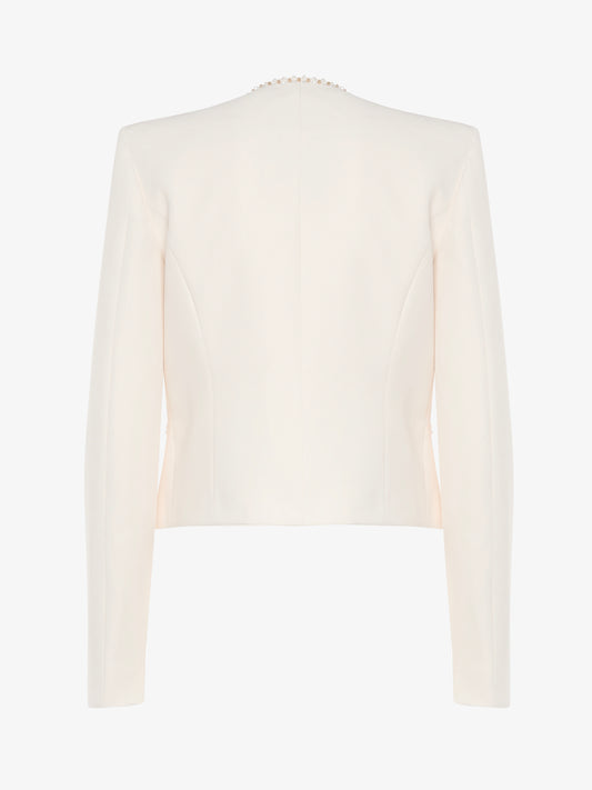 Short jacket in technical edge fabric with jewel applications