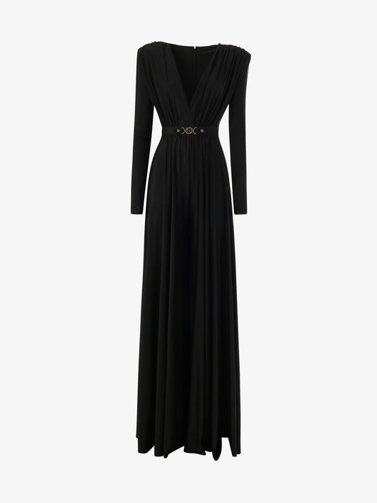 Elegant loose jersey jumpsuit with metallic accessory at the waist