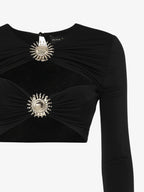 Top in jersey con cut out e decorazioni metalliche