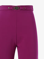 Pantaloni slim alla caviglia in tessuto tecnico con accessorio metallico in vita