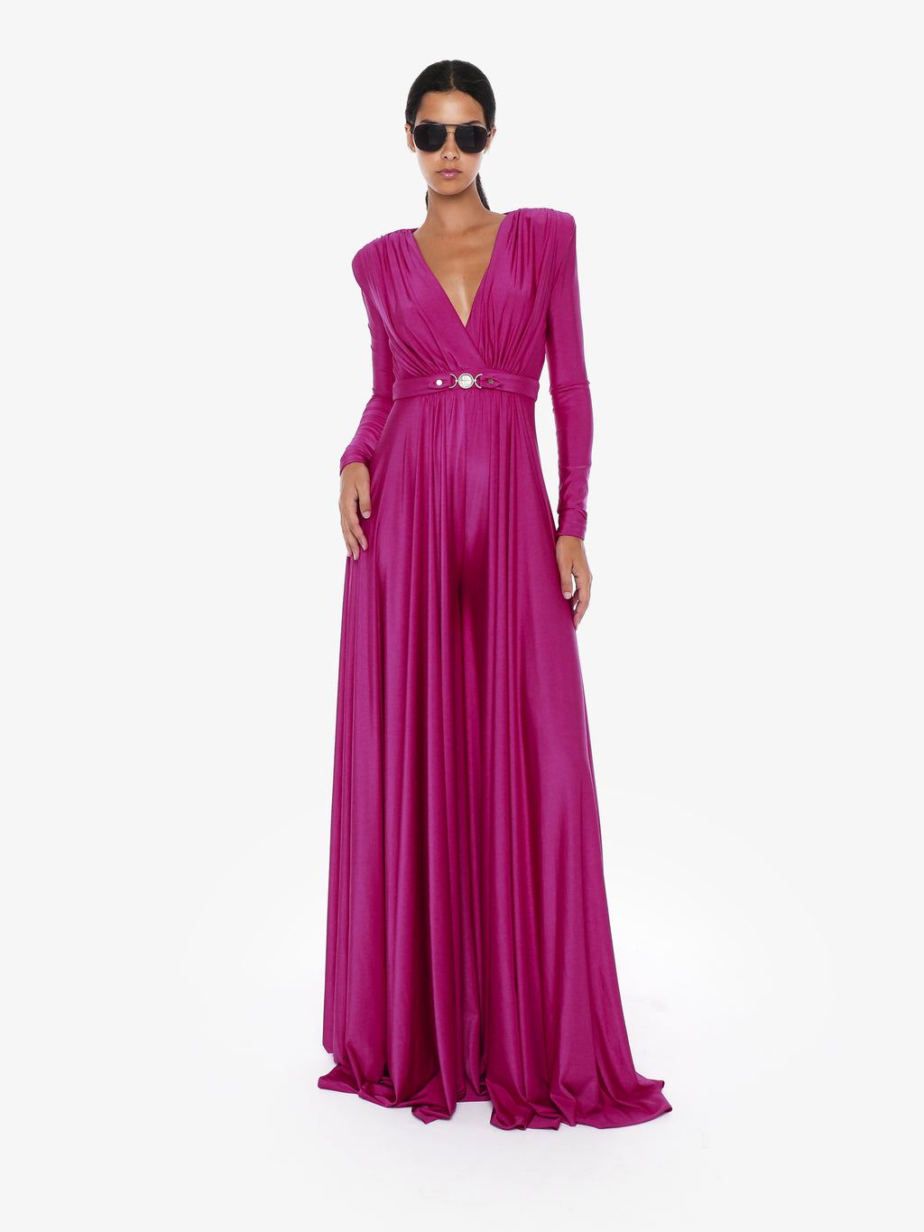 Elegant loose jersey jumpsuit with metallic accessory at the waist