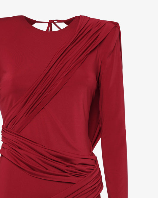 Abito lungo con schiena scoperta e drappeggi