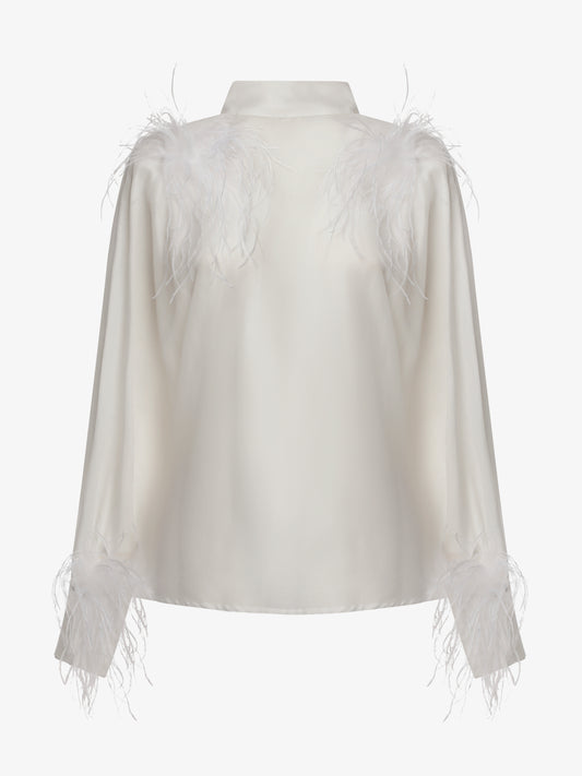 Blusa con bottoni sulla schiena e dettagli in piume