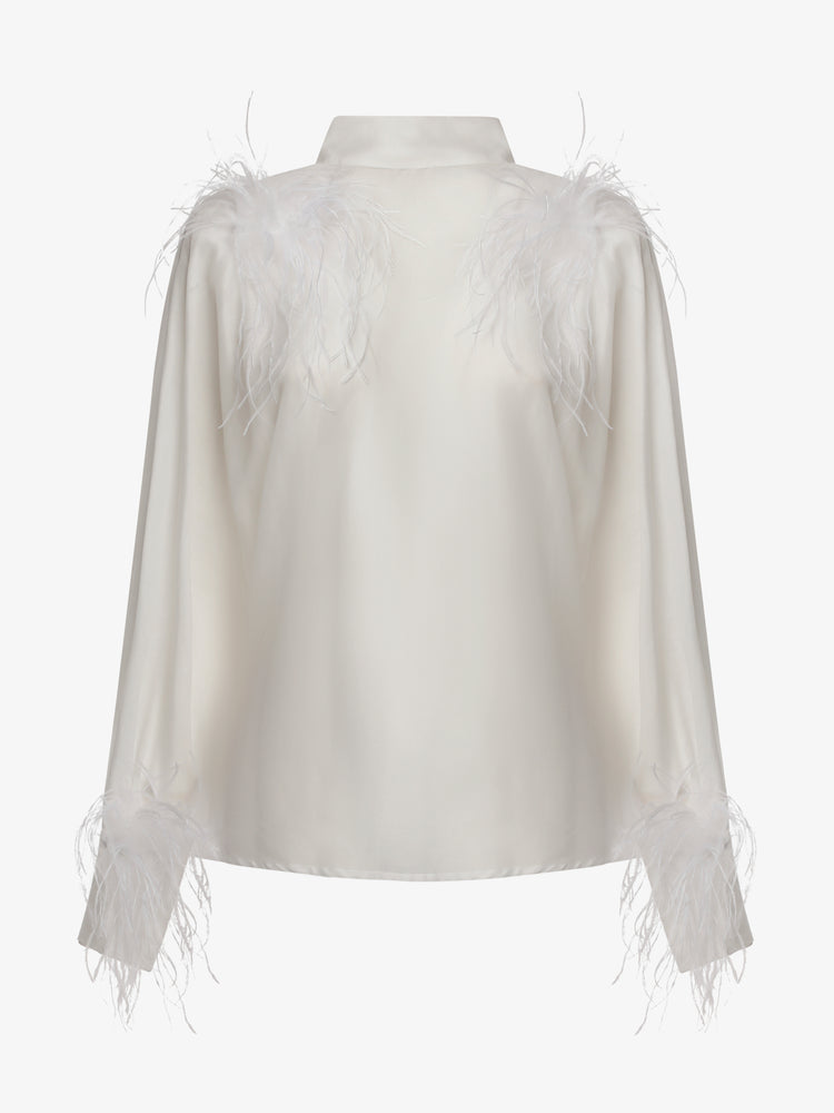 Blusa con bottoni sulla schiena e dettagli in piume