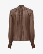 Blusa in georgette collo alto con applicazioni in strass